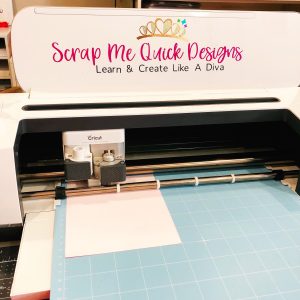 Placement of Cricut Cutting Mat in to Cricut Maker Machine for Cutting of Monogram Image
