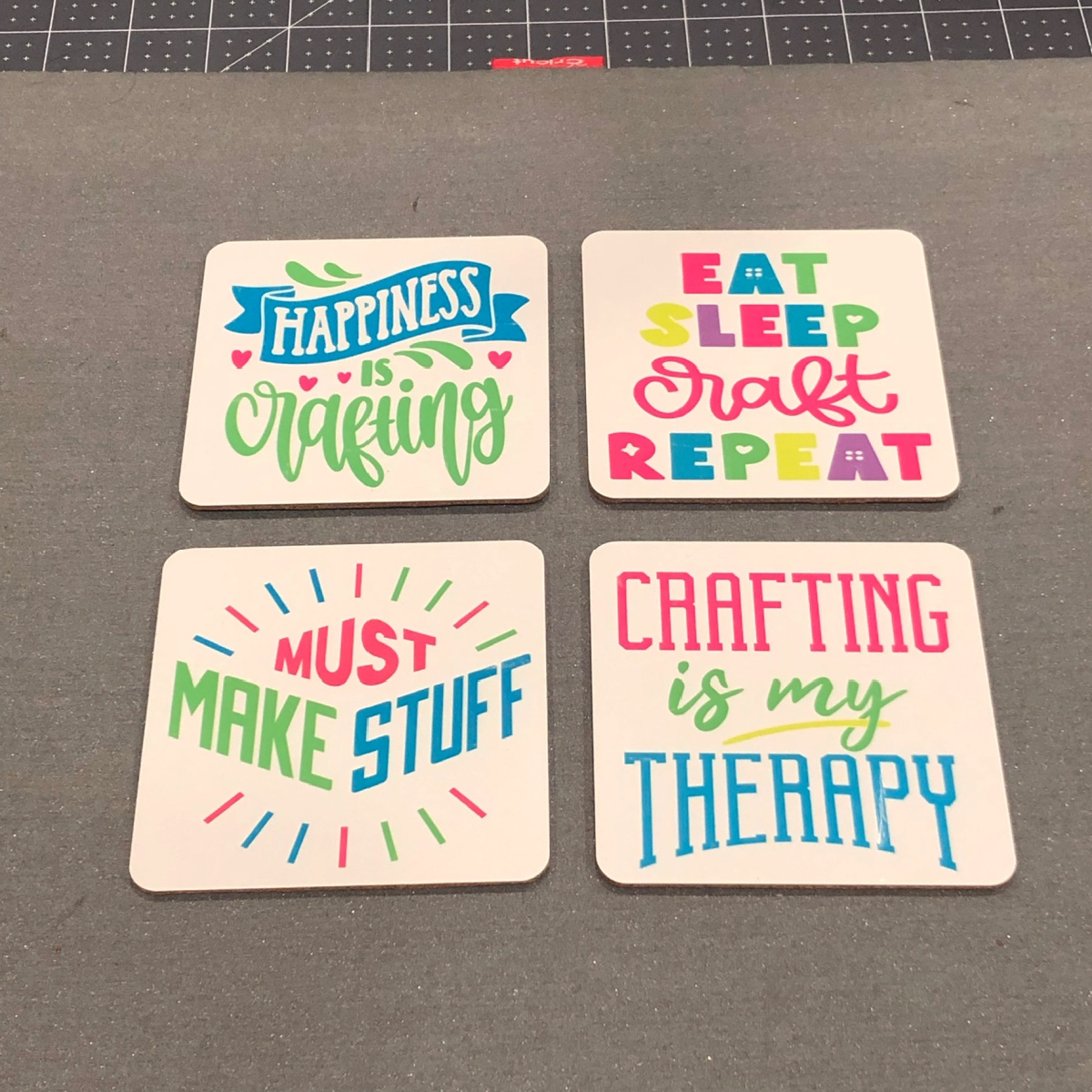 set of 4 coasters with crafty phrases that have been sublimated on the coasters