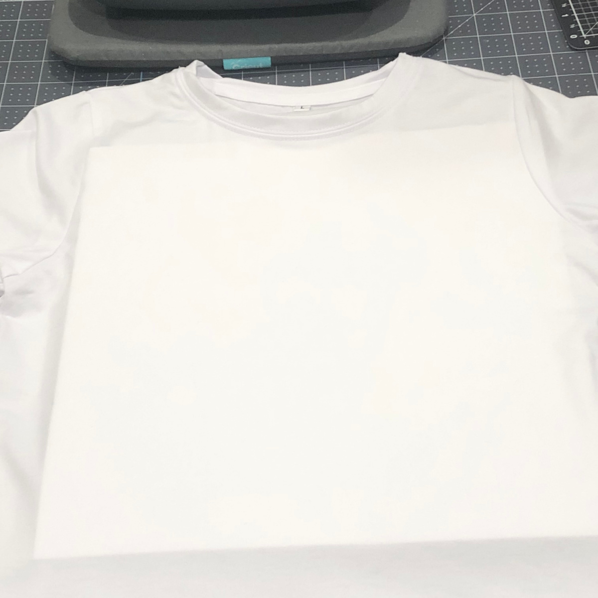 Cricut white sublimation t-shirt with 12X12 white cardstock inside shirt