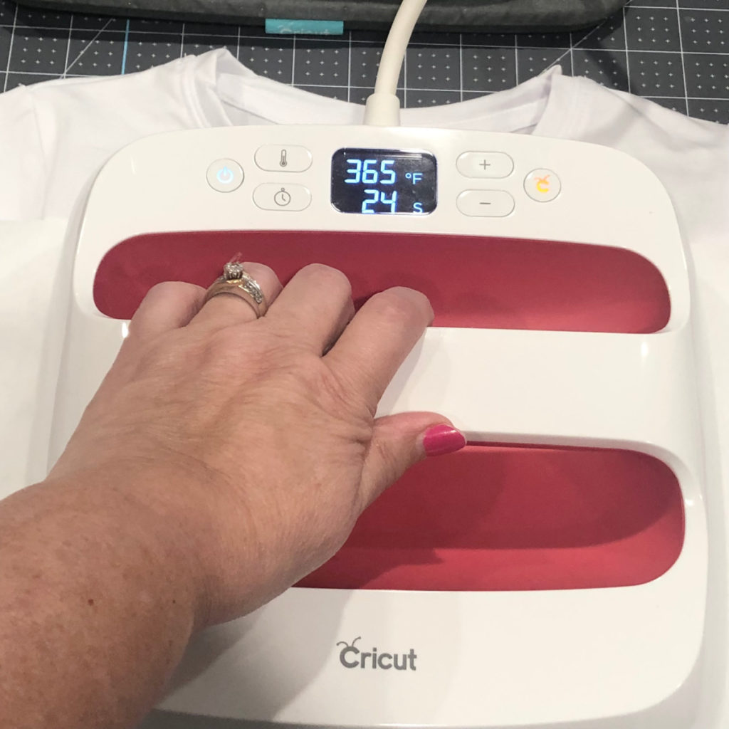 Cricut Easy Press heat press directly on top of the butcher paper and t-shirt
