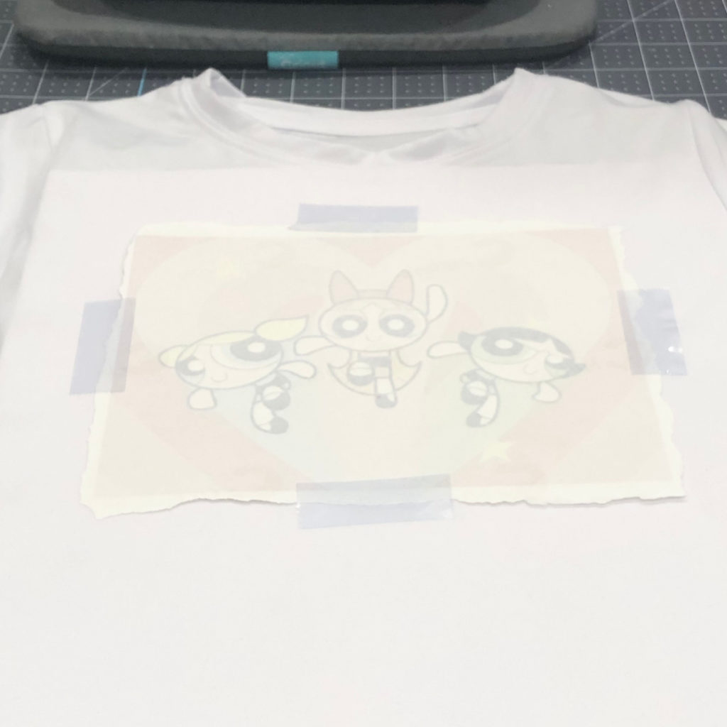 butcher paper removed from the heated sublimation image on white t-shirt
