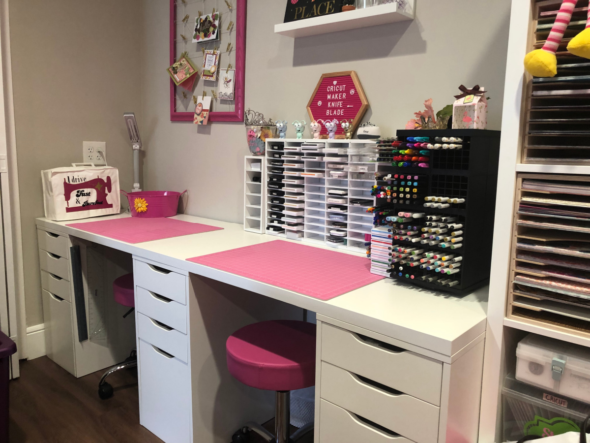two white craft desk with ink station and sewing station with pink craft mats and pink stools
